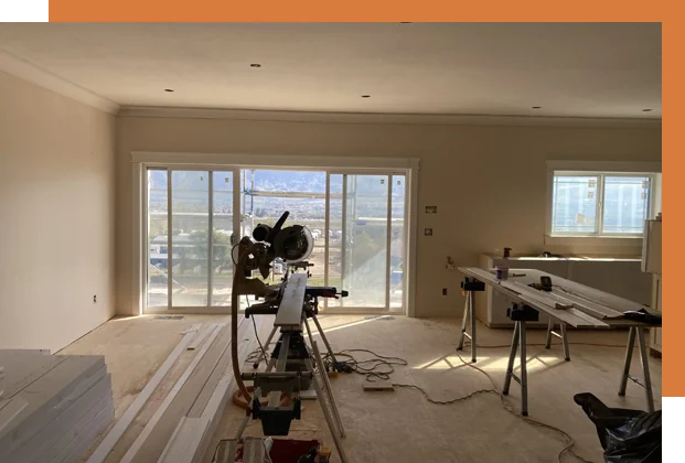 A room being remodeled with a large window.