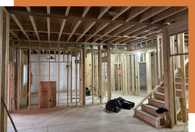 A room being built with wood framing and stairs.