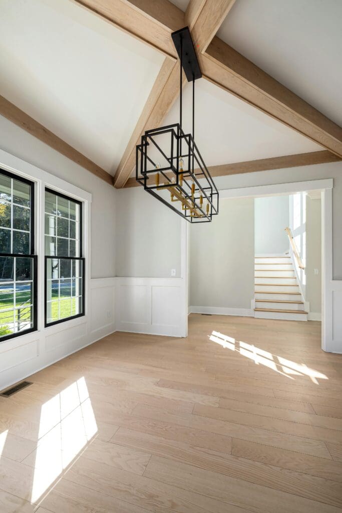 A room with windows and wooden floors